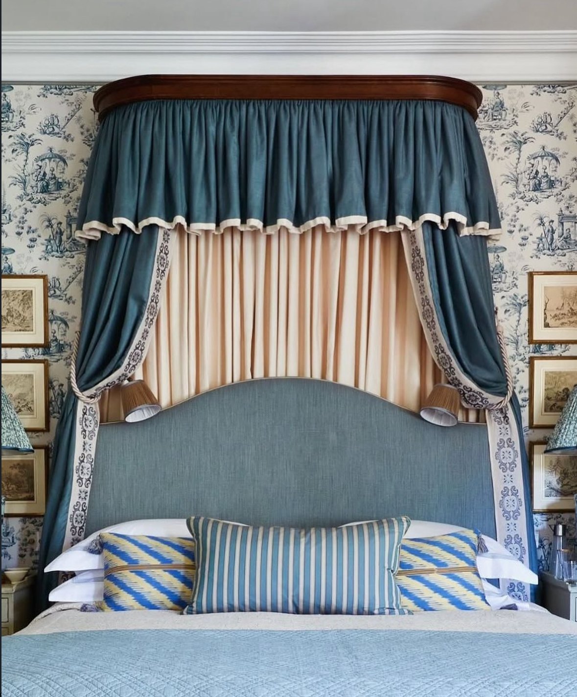 Bespoke curtains with a fitted pelmet over a bed
