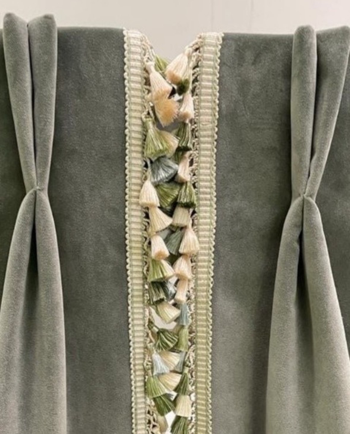 Detail of curtain tie-backs with a tasselled trim
